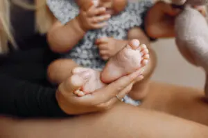 Elegant mother with cute little daughter in a studio