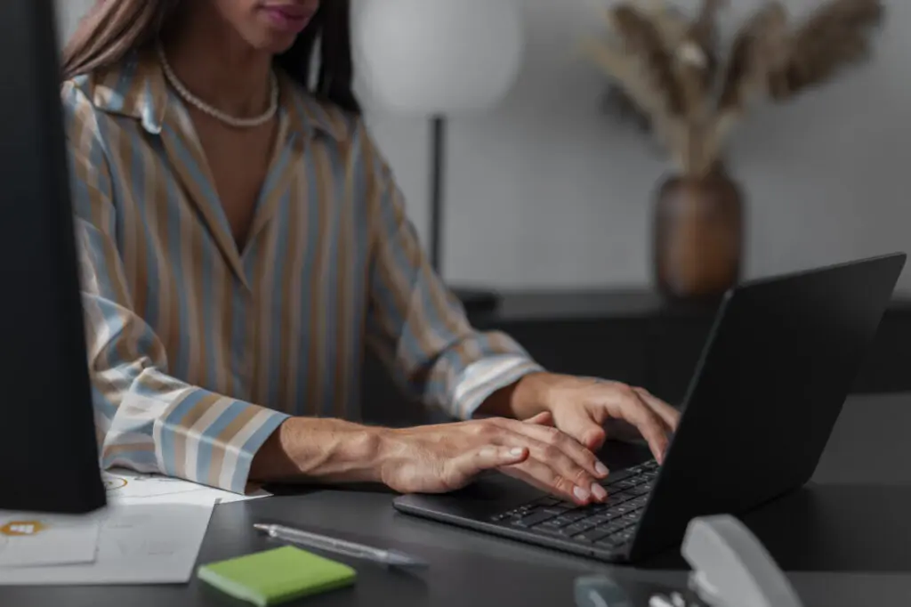 side-view-queer-model-working-with-laptop