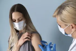female-patient-with-medical-mask-getting-vaccine