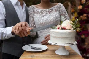 front-view-couple-cutting-cake