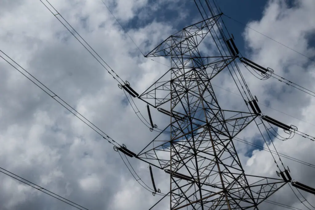 Power lines with clouds in the background