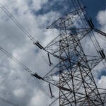 Power lines with clouds in the background