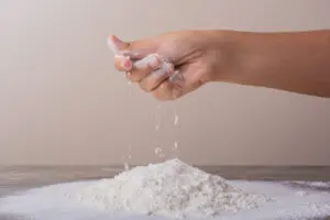 Putting all purpose flour to make dough