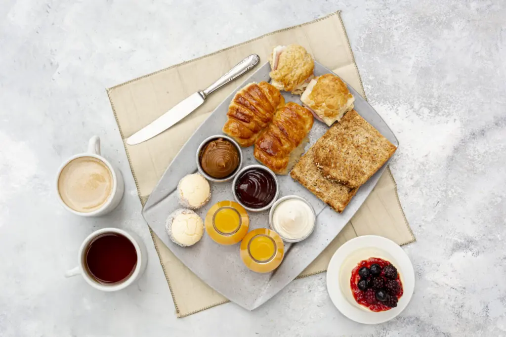 flat-lay-assortment-with-delicious-breakfast-cappuccino