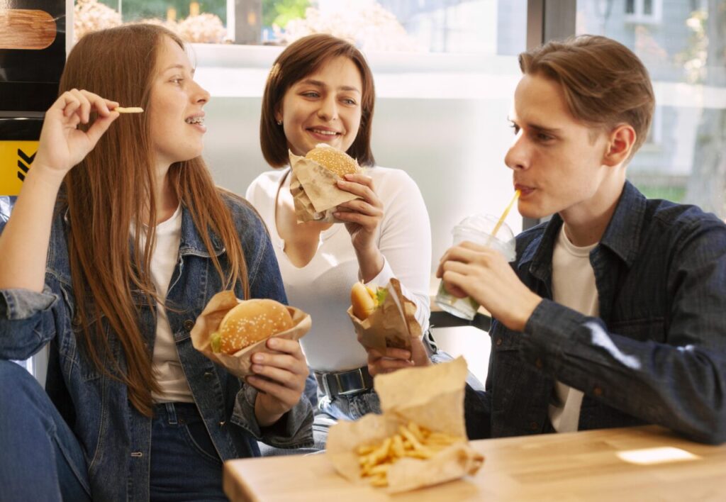 group-friends-eating-fast-food-together