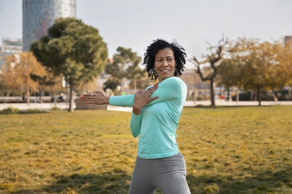 senior-woman-doing-yoga-outdoors-park