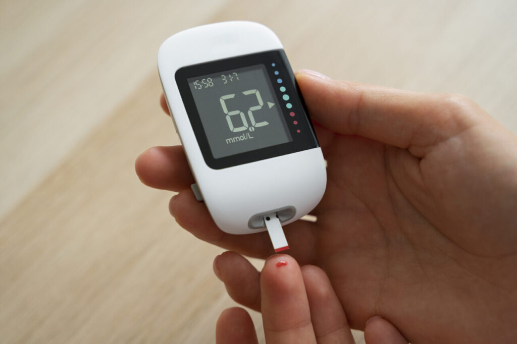 top-view-diabetic-woman-checking-her-glucose-level