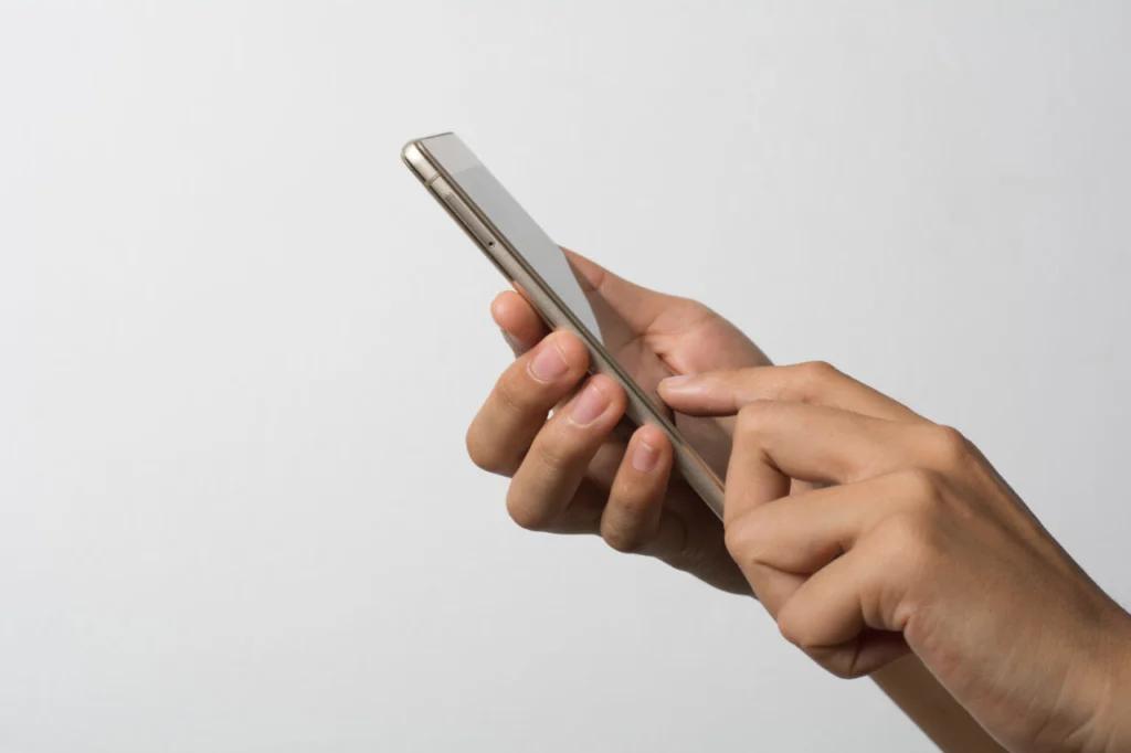 Woman Hand holding smart phone blank screen. Copy space. Hand ho