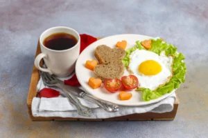 Breakfast on Valentine’s Day – fried eggs and bread in the shape