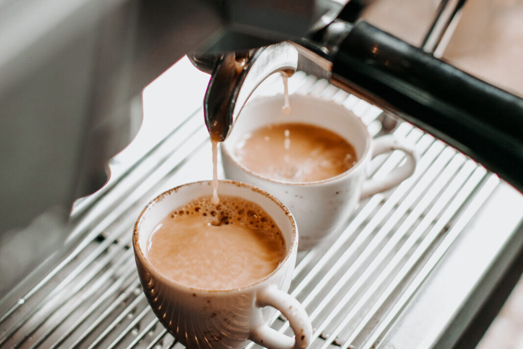 two espresso cups under coffee engine _
