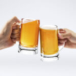 Men toasting with beer on white background